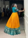 YNF 5028 MST Tasar Chex Patola Print With Weaving Work Border Gown With Koti Wholesale In India